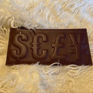 3.1 Philip Lim burgundy wallet zip